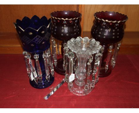 A pair of ruby glass lustre vases with clear glass drops, 36cm high, a blue glass lustre and a clear glass lustre, (4).