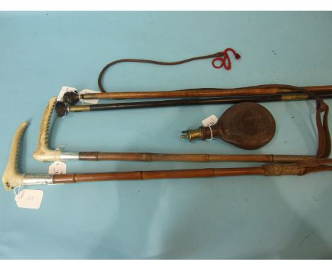 A horn-handled silver-mounted cane hunting whip by Swain and Adeney, London, the silver mount dated 1935, a horn-handled silv