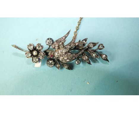 A Victorian diamond brooch in the form of a swallow, pavé-set with old brilliant and rose-cut diamonds and ruby eye, on a ste