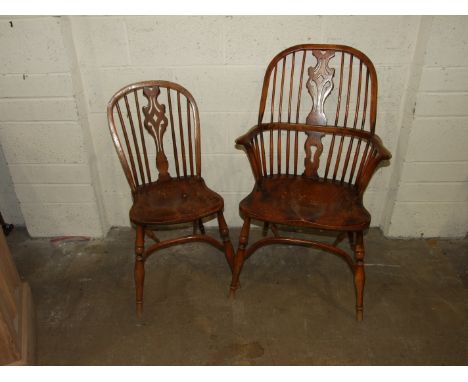 A set of six elm stick-back dining chairs, including two Windsor armchairs, each with solid seat, on turned legs with crinoli