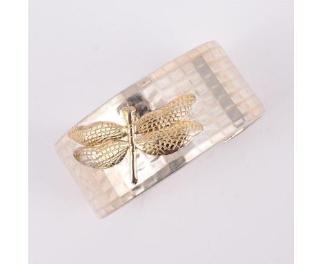 
	
		TIFFANY &amp; CO., A DRAGONFLY CUFF BANGLE 
		The polished textured cuff with dragonfly detail, stamped &#169;2003 TIFFA