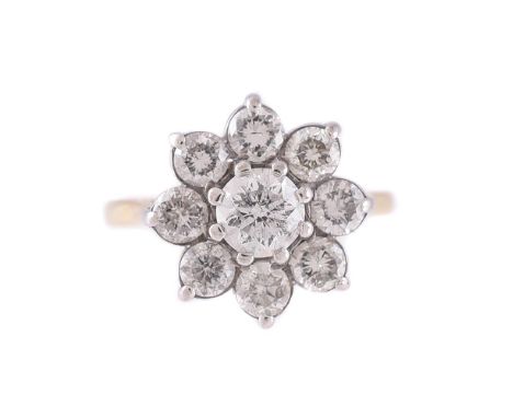 
	
		A DIAMOND CLUSTER RING 
		The brilliant cut diamond eight claw set within a surround of eight brilliant cut diamonds, to