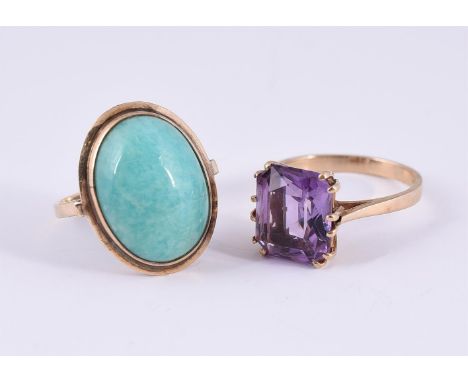 
	
		TWO DRESS RINGS 
		The first a mixed cut amethyst dress ring, London 1996, in a 9 carat gold setting; together with an o