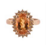 A TOPAZ AND DIAMOND CLUSTER RING