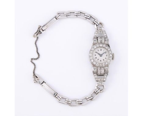 
	
		UNSIGNED
		A LADY&#39;S PRECIOUS WHITE METAL AND DIAMOND COCKTAIL WATCH
		Movement: Cal. 525, manual wind, 15 jewels
		C