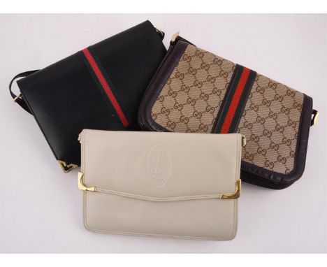 
	
		TWO GUCCI HANDBAGS 
		Comprising: Gucci, a brown leather and canvas handbag, with a leather shoulder strap and a stirrup