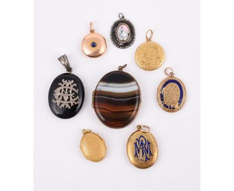 
	
		Y&nbspA COLLECTION OF ANTIQUE LOCKETS
		To include a late Victorian polished circular gold hinged locket with a central 