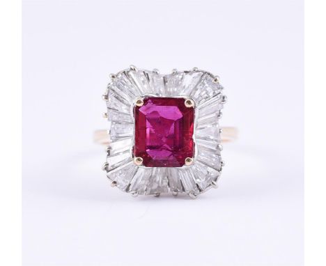 
	
		A RUBY AND DIAMOND CLUSTER RING
		The rectangular cut ruby with canted corners, within a tapered baguette cut diamond ba