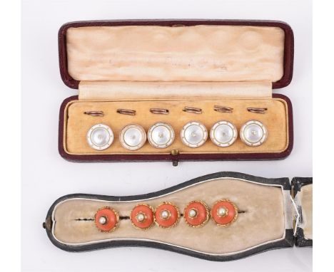 
	
		Y&nbspFIVE ANTIQUE CORAL BUTTONS 
		CIRCA 1800
		The circular cabochon coral with a half pearl within a petalled surroun