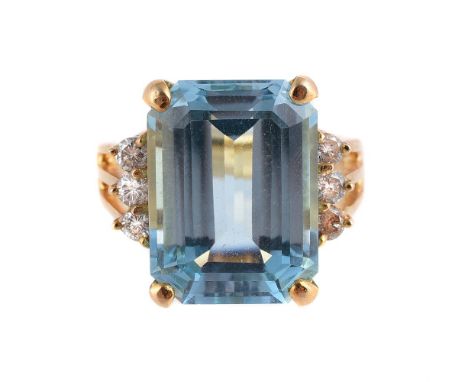 
	
		A BLUE TOPAZ AND DIAMOND RING
		The step cut blue topaz with canted corners four claw set between brilliant cut diamond 