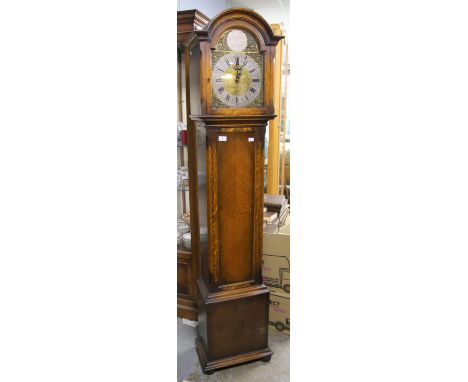 Modern oak longcase clock the brass dial with silvered chapter ring and roman numerals, striking on eight gongs, H150cm