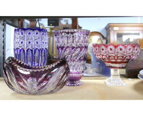 Four pieces of overlay glass, two large vases, a centrepiece bowl on single pedestal, and another centrepiece bowl.