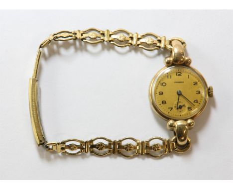 Longines A ladies gold wristwatch, the signed dial with Arabic numeral hour markers within a minute track and subsidiary seco