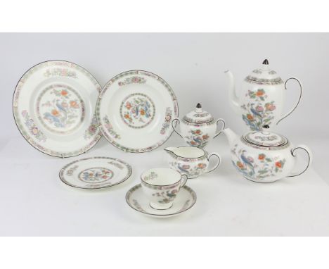 A Wedgwood Kutani pattern part dinner and coffee service, with ten dinner plates, twelve soup bowls, ten small plates, eleven