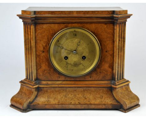 19th century burr walnut mantle clock the gilded dial with roman numerals, the two train movement striking the hours and half