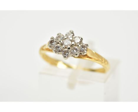 AN 18CT GOLD DIAMOND CLUSTER RING, designed with a lozenge of claw set round brilliant cut diamonds, total estimated diamond 