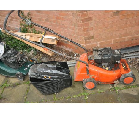 A FLYMO PETROL LAWN MOWER with grass box (engine pulls freely but hasn't been started)