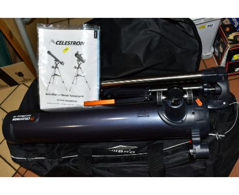 A CELESTRON ASTROMASTER 76 TELESCOPE, with stand, manual and canvas bag