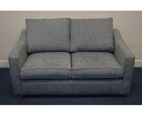 A GREY UPHOLSTERED TWO SEATER SOFA BED