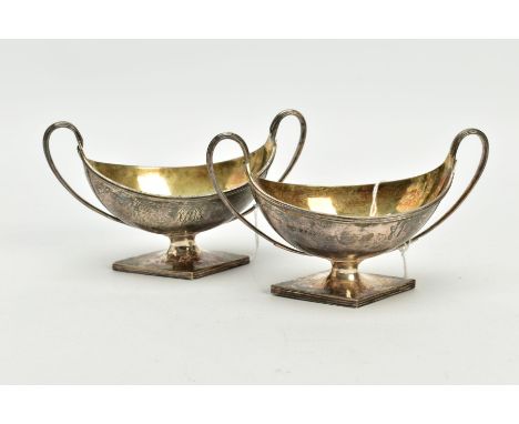 A NEAR PAIR OF GEORGE III STERLING SILVER SALTS, each twin handled oval urn form on a raised lozenge shape base, both with gi