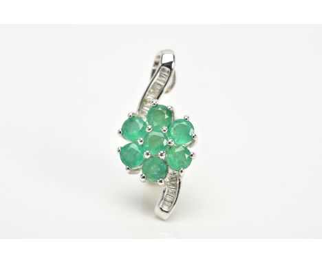 A 9CT WHITE GOLD EMERALD AND DIAMOND PENDANT, in the form of a flower, set with a central circular cut emerald flower, flanke