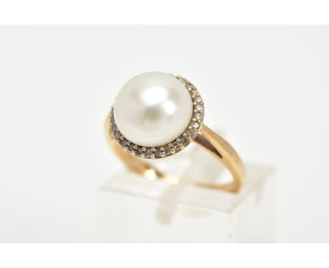 A YELLOW METAL PEARL AND DIAMOND RING, designed with a central cultured pearl, within a single cut diamond surround, tapered 