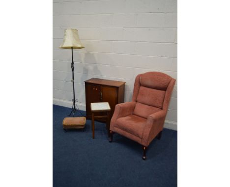 A HSL PINK UPHOLSTERED WING BACK ARMCHAIR, mahogany two door cabinet, wrought iron standard lamp and two stools (5)