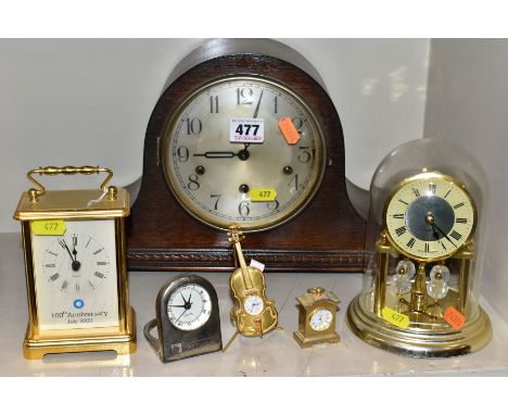 AN OAK CASED CHIMING MANTEL CLOCK, chimes but only runs for a few seconds, together with a quartz carriage clock with logo an