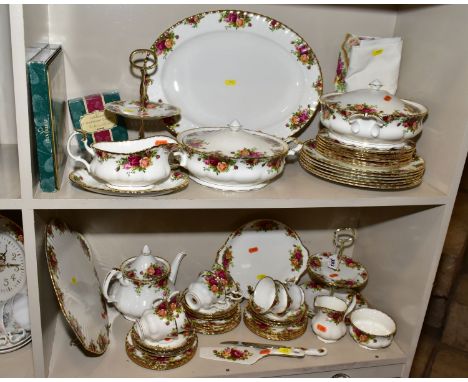 A ROYAL ALBERT OLD COUNTRY ROSES DINNER SERVICE, comprising an oval 41.5cm meat plate, two twin handled tureens and covers, a