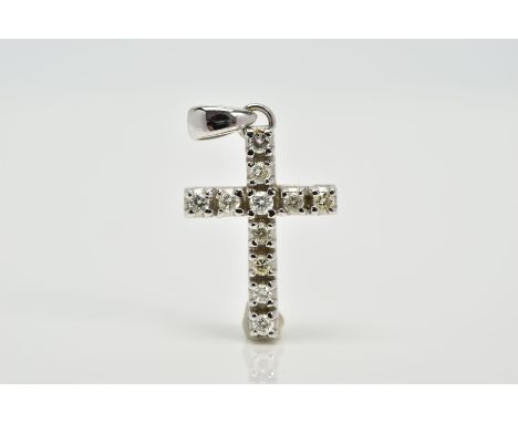 A WHITE METAL DIAMOND SET CROSS PENDANT, designed with eleven claw set round brilliant cut diamonds, to a plain polished tape