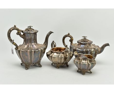 A FOUR PIECE SILVER TEASET, to include an elaborate foliate engraved wavy body of melon shape, scroll foliate, ivory banded h