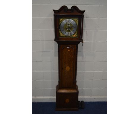 A GEORGE IV OAK AND CROSSBANDED EIGHT DAY LONGCASE CLOCK, the hood with a scrolled top and twin fluted columns, the glass doo