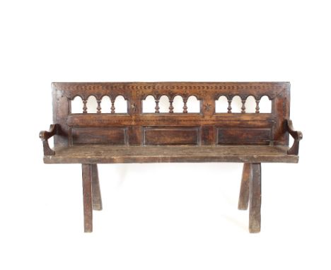 An Antique oak and inlaid hall bench, with baluster turned chevron and star decorated back, raised on square section supports