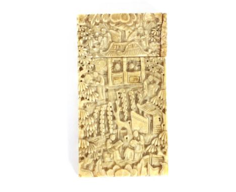 A small Chinese carved ivory card case, profusely decorated figures, pagodas and foliage; and a lacquered trinket box and cov