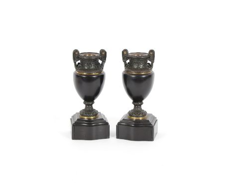 A pair of 19th Century marble and bronze mounted urns, of baluster form raised on serpentine plinths, 27cm high 