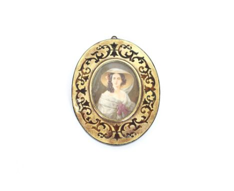 An oval portrait miniature, of Empress Eugenie, in tortoiseshell brass covered frame 