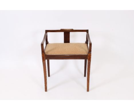 An Edwardian mahogany and boxwood strung piano stool, raised on slender tapering supports 