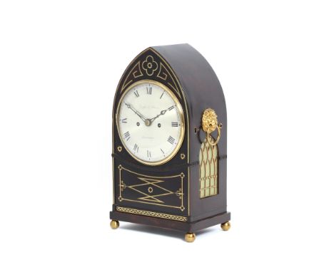 A Regency ebonised brass inlaid bracket clock, by Griffin & Adams of the Strand, the lancet shaped case enclosing a silvered 