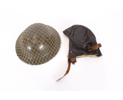 An RAF leather flying hat, Air Ministry label for 1940; and a steel helmet