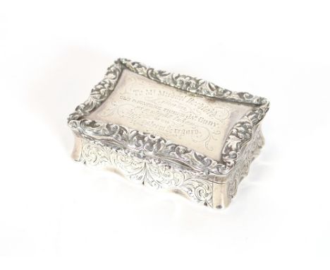 A mid Victorian large silver table top snuff box, having cast foliate border with presentation inscription to the lid, Birmin