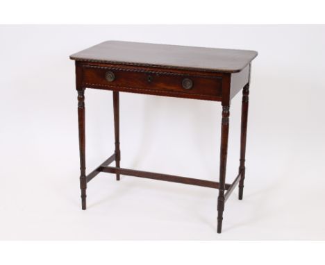 A George IV mahogany side table, the rectangular top with rounded corners, fitted with a single frieze drawer, on turned and 