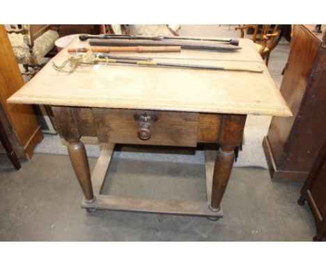 A continental elm side table, fitted with single drawer, raised on turned baluster supports, united by flat stretcher, termin