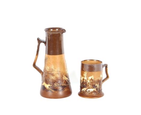 A Doulton stoneware hunting jug, depicting huntsmen and hounds in full cry, 26cm high; and a matching mug, 13.5cm high, (2) 