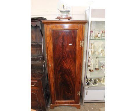 A Victorian walnut and mahogany single wardrobe, raised on bracket feet, 69cm wide x 183cm high