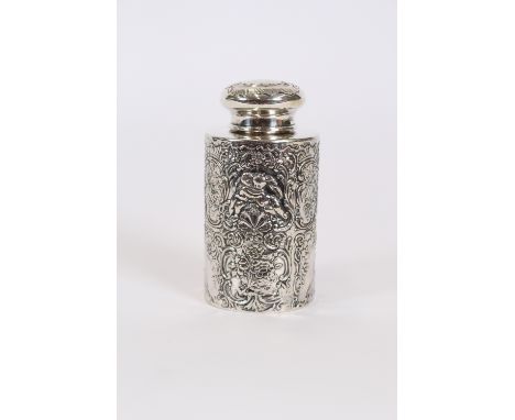 A continental white metal cylindrical tea caddy and cover, profusely embossed figures and foliate scrolls, 11cm high, stamped