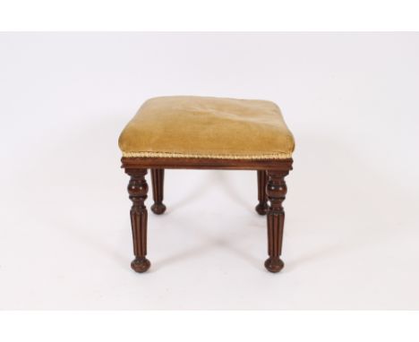 A Victorian mahogany framed dressing stool, raised on turned and fluted supports