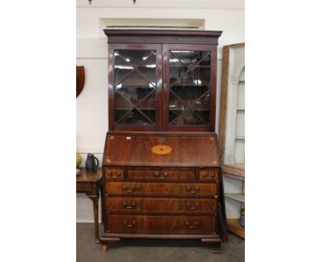 A Georgian mahogany satinwood strung and inlaid bureau, the fall front opening to reveal a fully fitted interior, drawers, pi