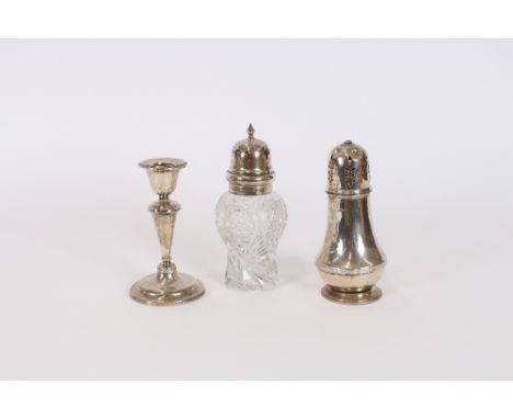 A silver sugar castor, of baluster reeded form (some damage), 17.5cm high; a hobnail cut glass baluster sugar shaker, having 