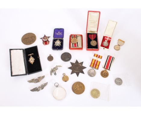 A collection of various medals and medallions, to include a Wellington Memorial Plaque; a Far East Inter Ocean Freight Servic