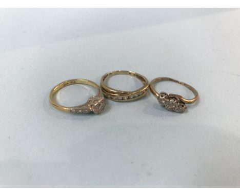 Two 9ct gold rings, 3.5g, and an 18ct gold ring, 2.6g